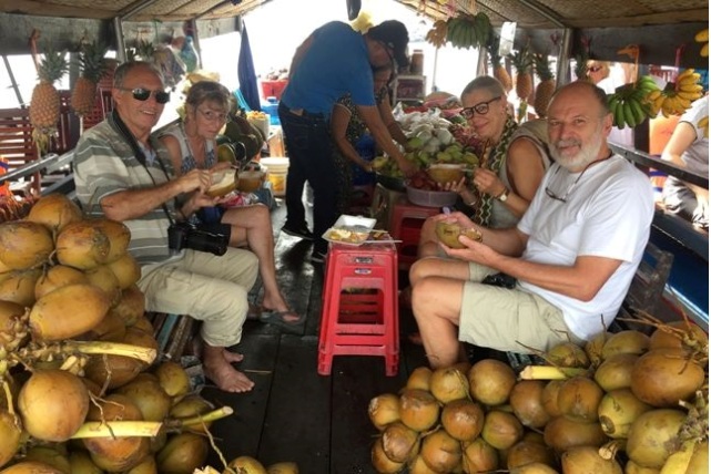 Enjoy fruits in Cai Be Floating market